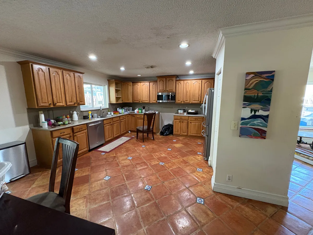 Dated kitchen with oak cabinets — before renovation